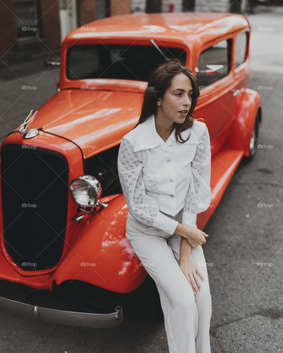 a beautiful woman with a beautiful car