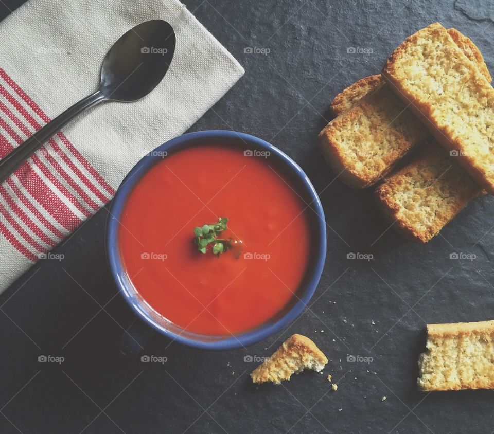 Close up of tomato soup with bruschetta