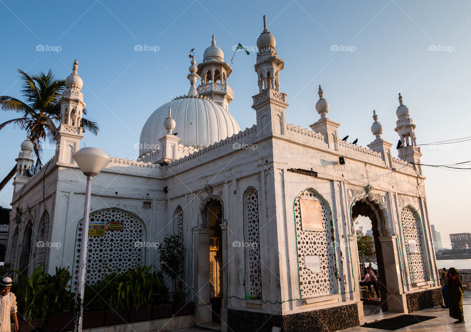 The Haji Ali Dargah is a mosque and dargah (tomb) or the monument of Pir Haji Ali Shah Bukhari located on an islet off the coast of Worli in the southern part of Mumbai.- wiki