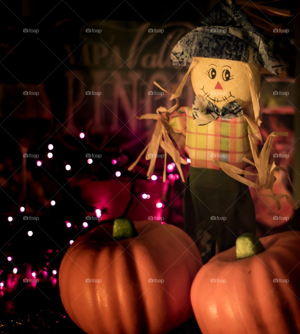 Scarecrow and pumpkins