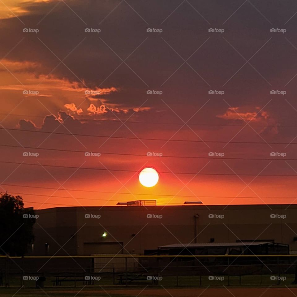 A lightning caused brush fire creates an incredible sunset as the light gets filtered through the smoky haze