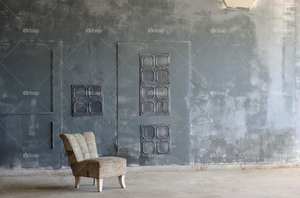 A chair in grey empty room