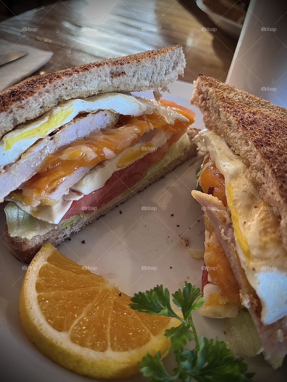 Breakfast sandwich , tomato cheese egg and peameal 