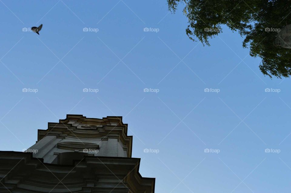 Clear blue sky above the historic church in Poland