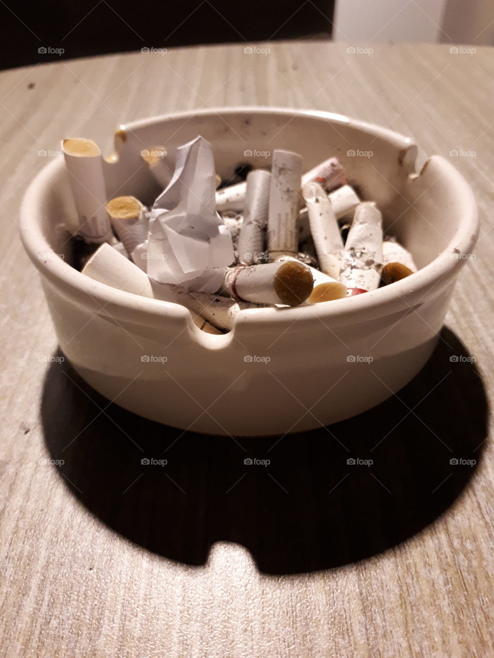 ashtrays full of cigarettes