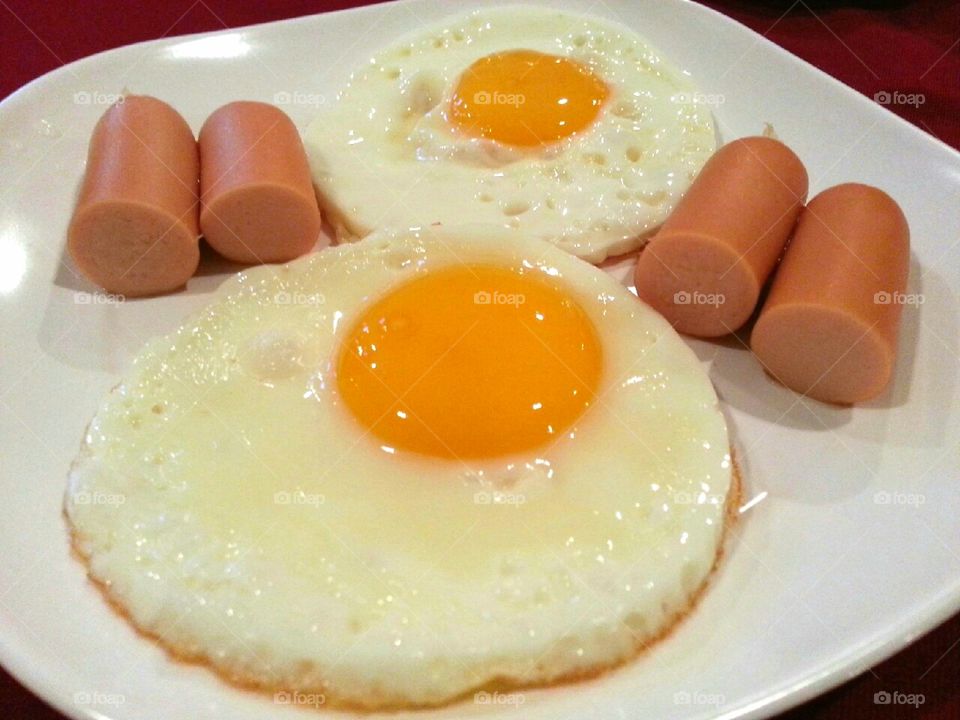 Fried eggs with sausage