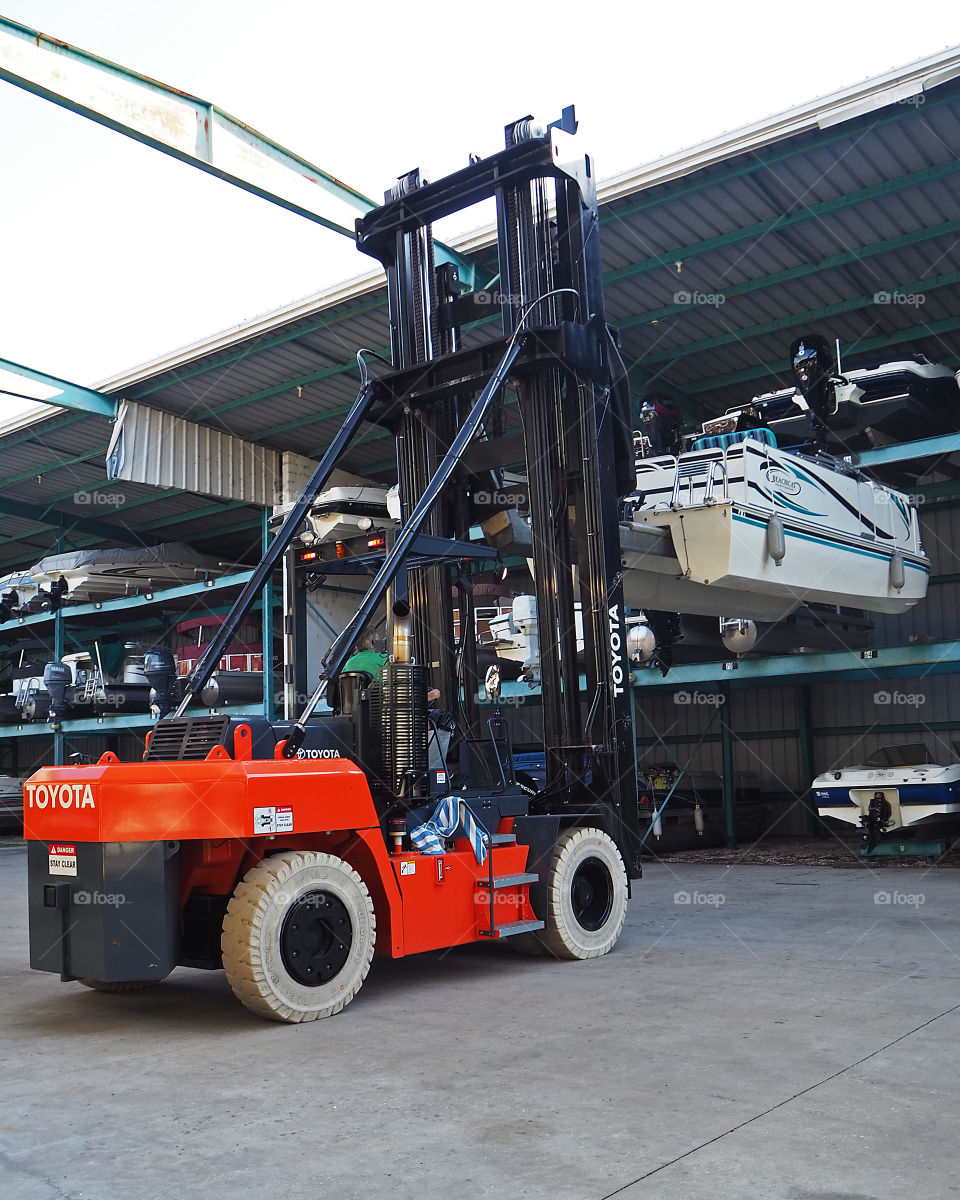 Toyota boat forklift moving boat from point A to B