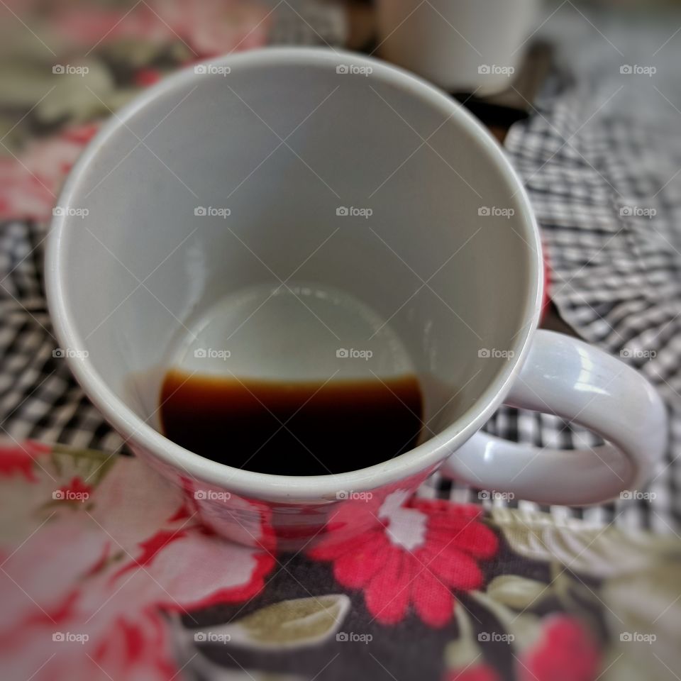 Black coffee at the bottom of the mug