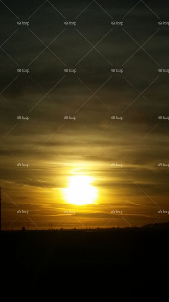 Ah what a lovely Golden sunset
With ribbons of clouds 
Complementing a Golden Sunset 
How, beautiful to be able to see
And capture the Golden Ribbon Sunset
And that is the name of this picture
Fit to be tied... The Golden Ribbon Sunset
I like it.