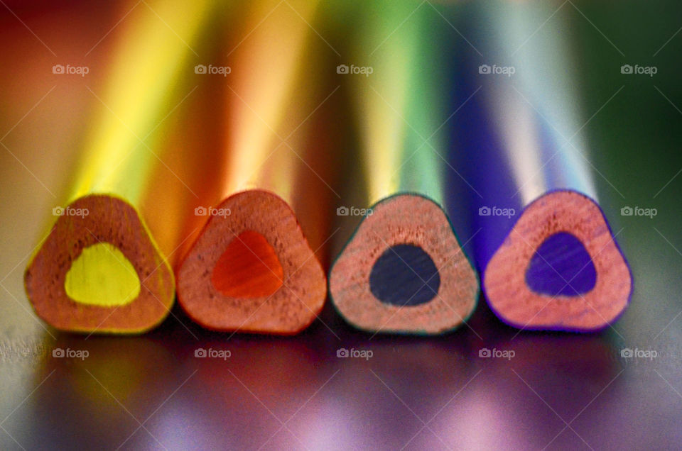 Color pencils reflecting on table