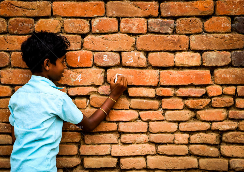 A soulful story of a village school girl who is practising numerical values in wall....  #Education #numbers
