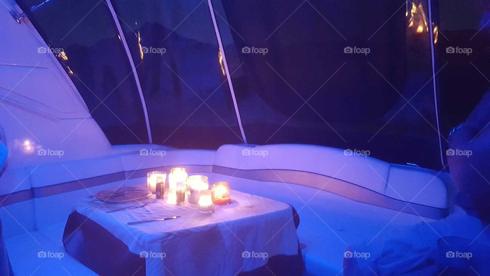 Candlelight romantic dinner on a boat