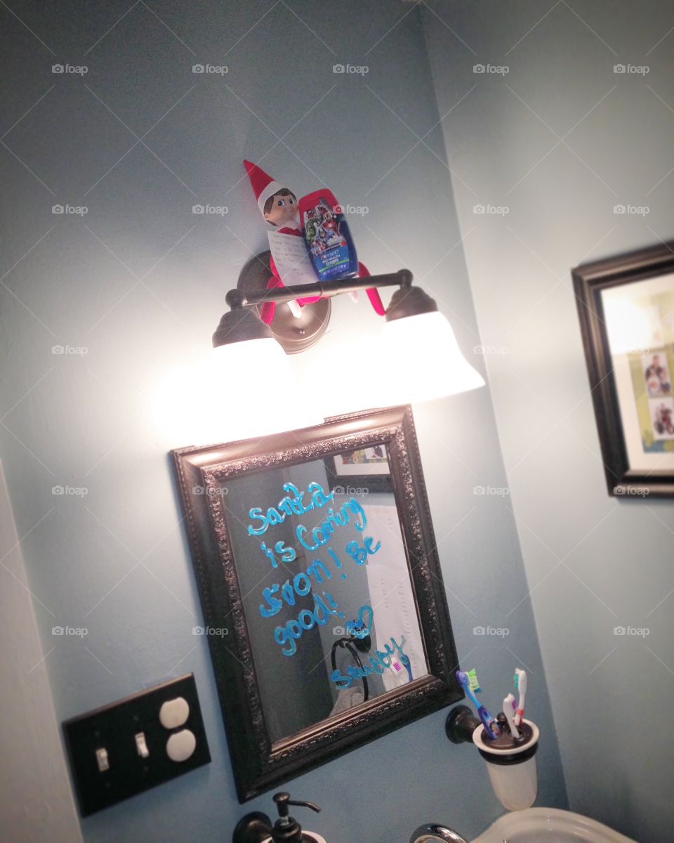 Elf on the shelf in bathroom 