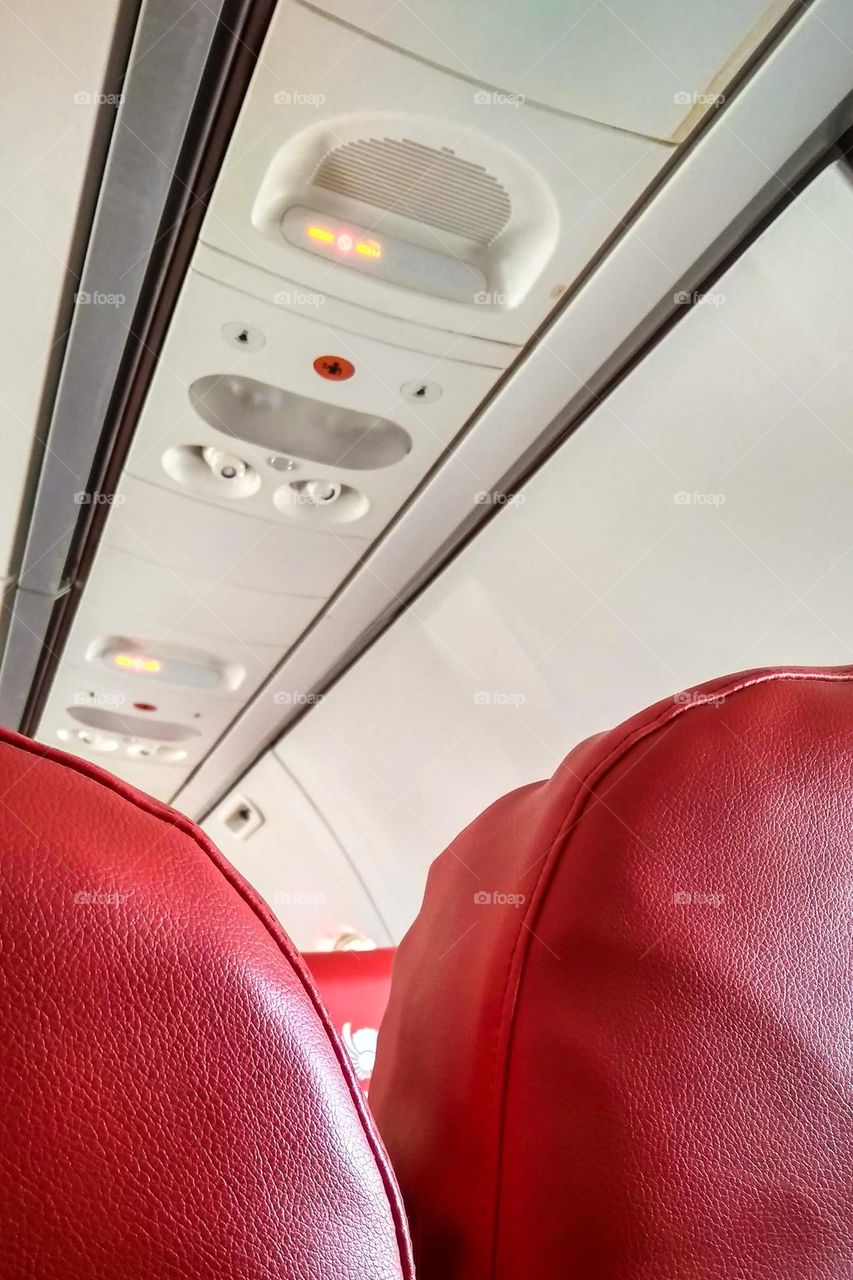 Passenger seats in the aircraft cabin in high angle view