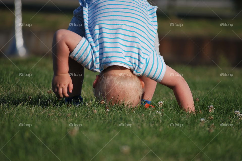 practising somersault in the park