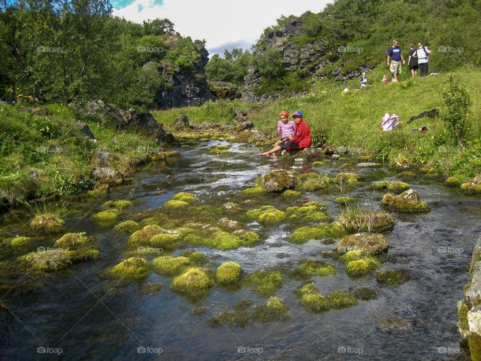 Sitting by the stream taking a break from hiking.  A summer day spent outdoors is time well spent.