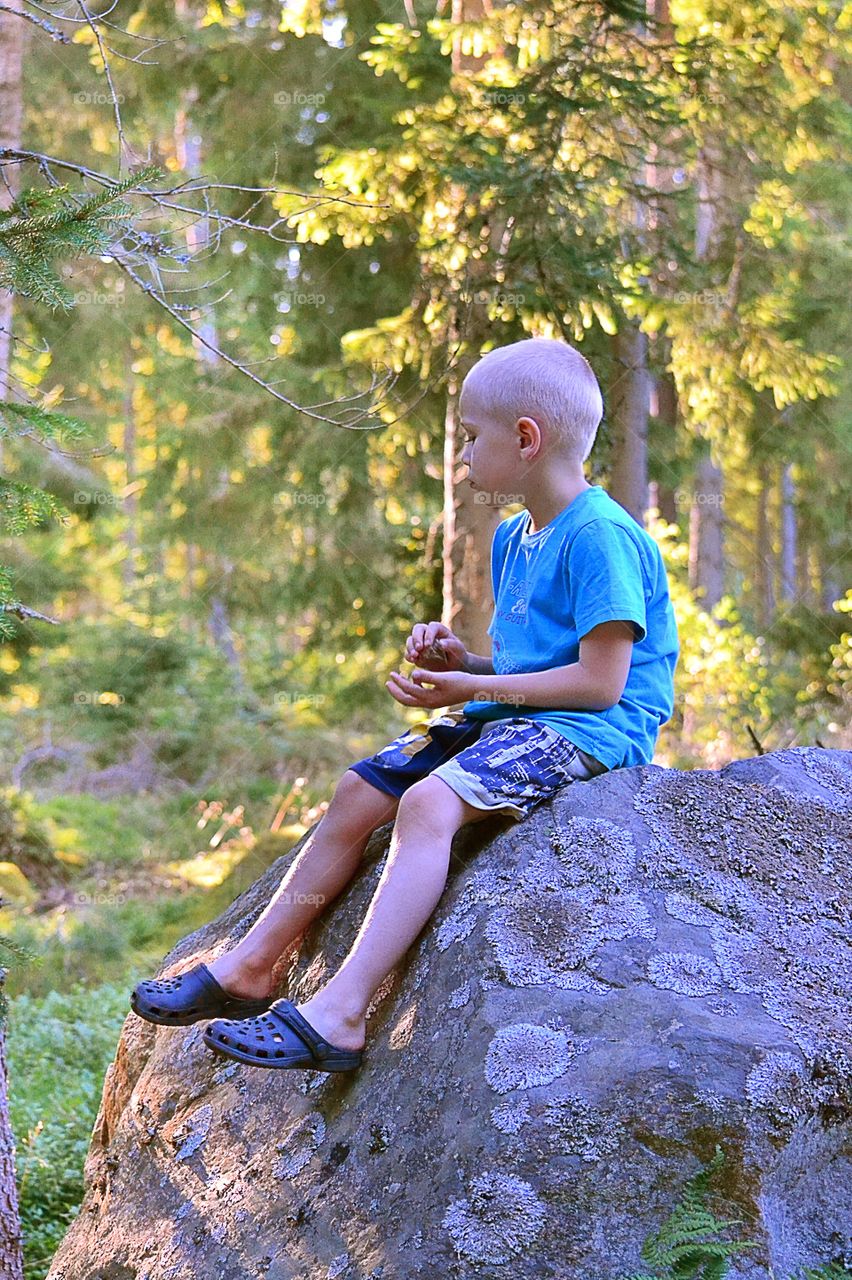 Enjoying the day. Boy in the forest enjoying the day