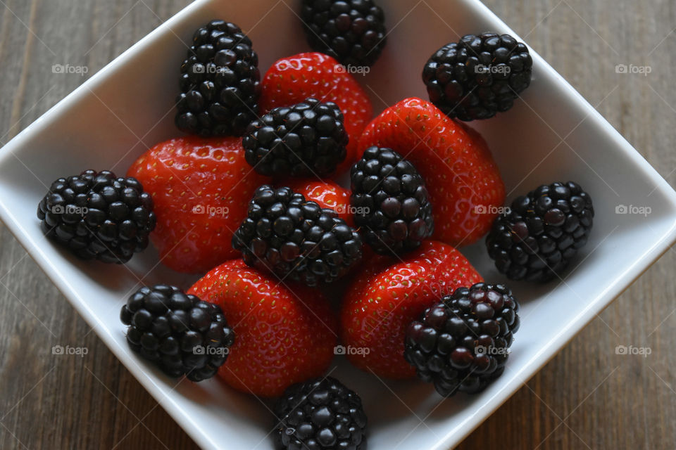 Bowl of strawberries and blackberries