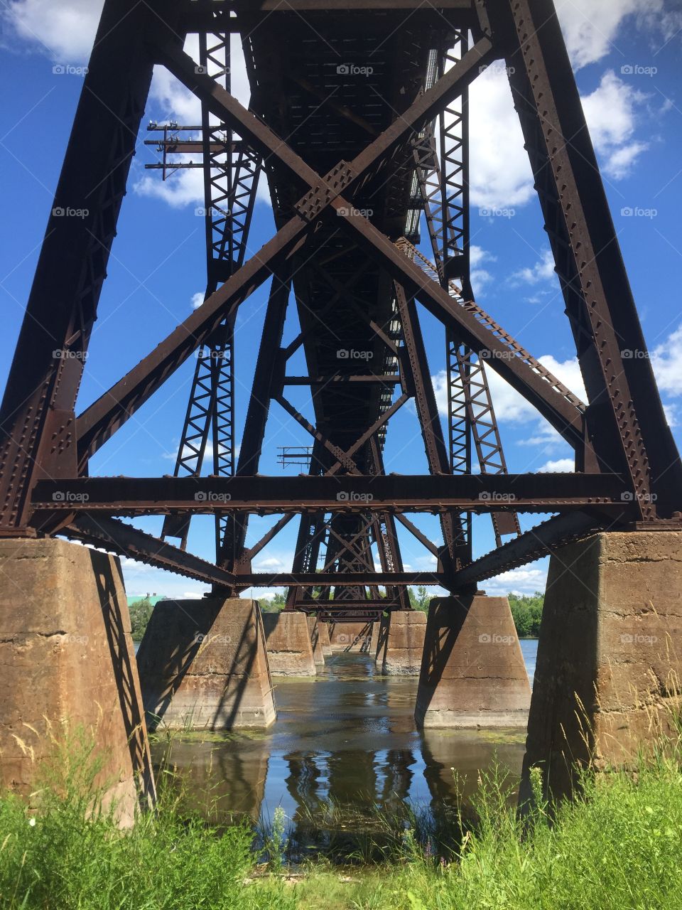 Train bridge over the river, concrete and metal