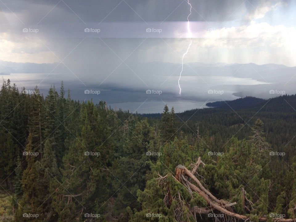 Lightning strikes California's pristine alpine lake, Lake Tahoe during a electric summer storm.