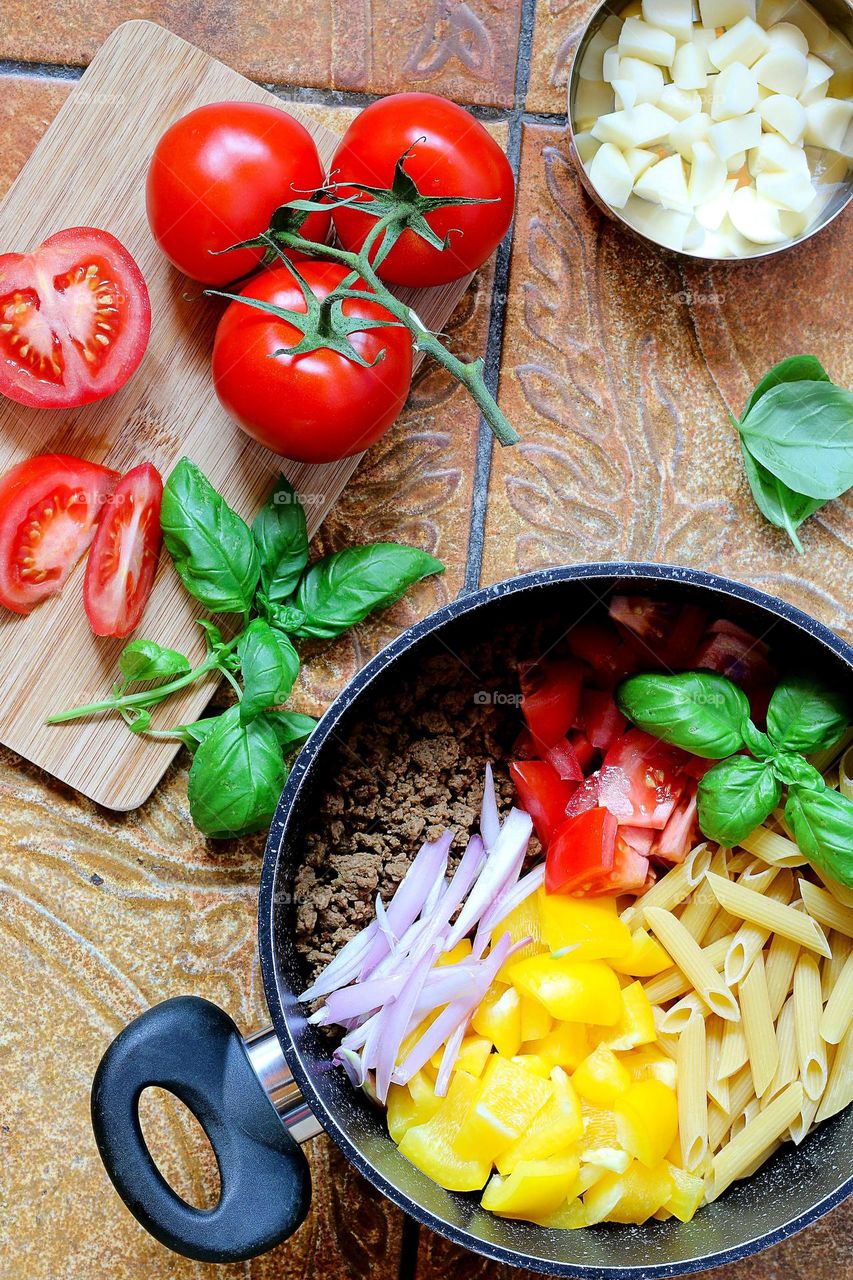 Freshly made pasta dishes using colorful  vegetables as seasonings are completed.