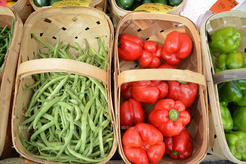 Farmers Market with Red Peppers and Green Beans. Organic Vegetable a placed in baskets for sale.