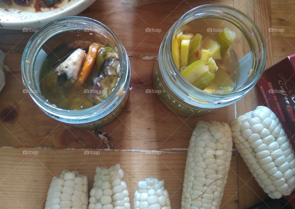 Homemade Spanish sardines is my favorite kind sardines now. I also have pickled mango and other vegetables. These white small nutritious local corns are sweet when cooked with water. Filipinos like it.