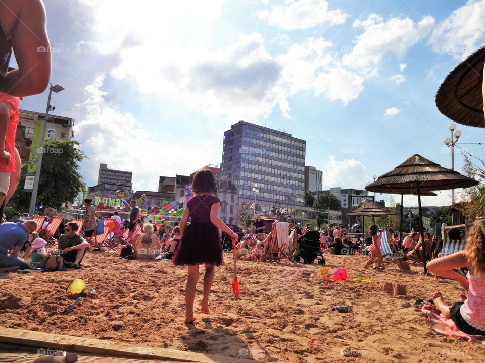 Nottingham Riviera, temporary artificial urban beach and fairground in the Old Market Square, Nottingham city centre UK