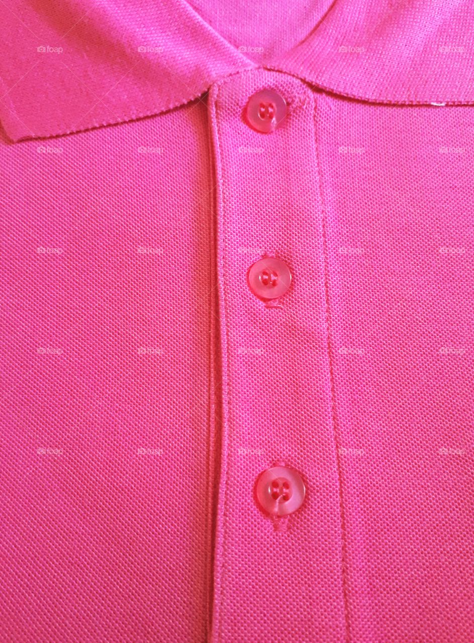 A folded pink shirt