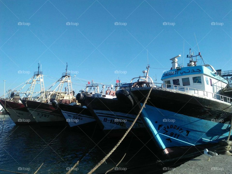 Blue ships  in harbour at essaouira city in Morocco.