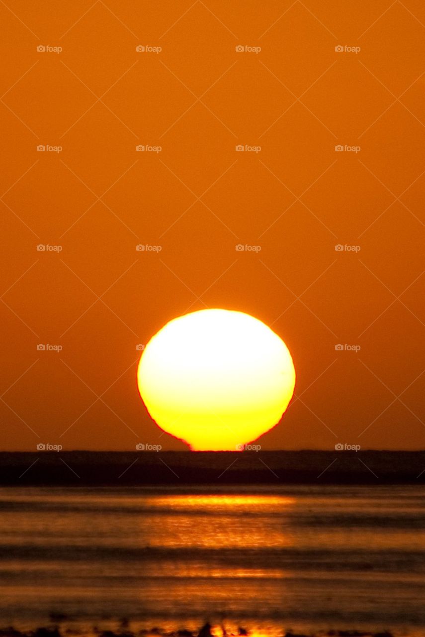 Hot Sunset Over Water