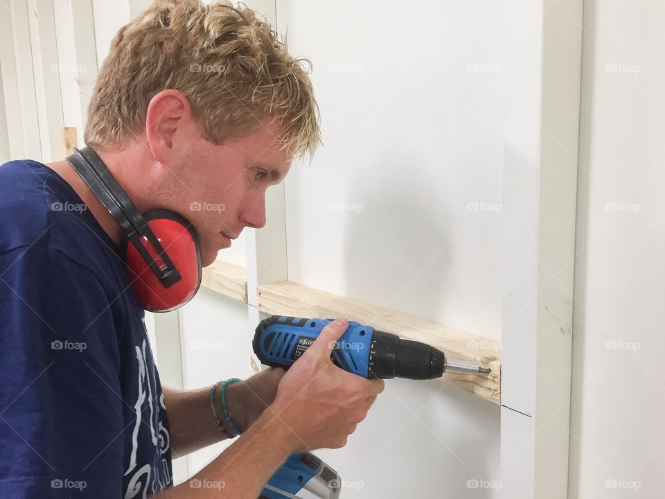 Man working with a screwdriver.