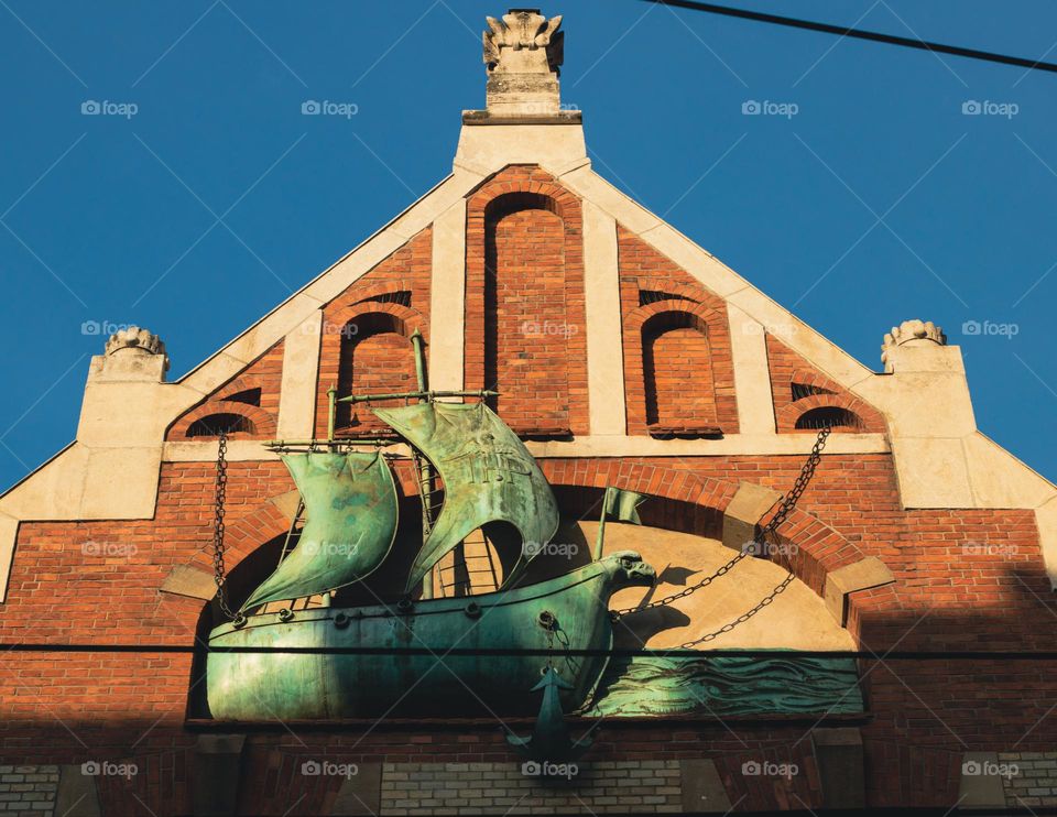 beautiful ship on the facade of a tenement house in Krakow