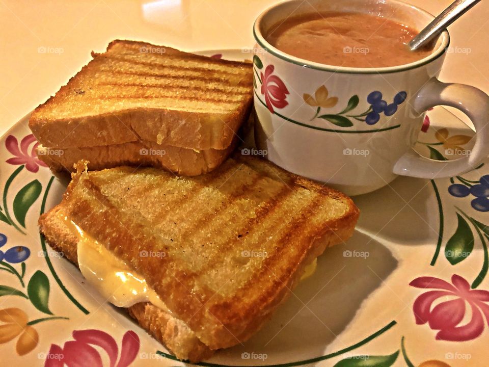 Grilled gouda and provolone cheese sandwich with tomato soup 