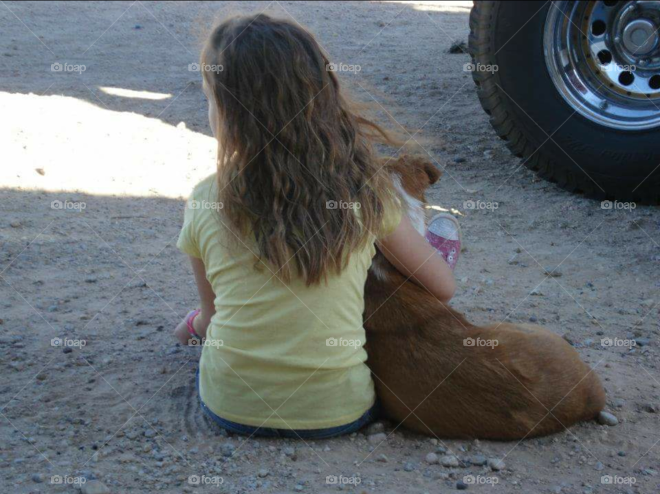 A little girl and her dog.
