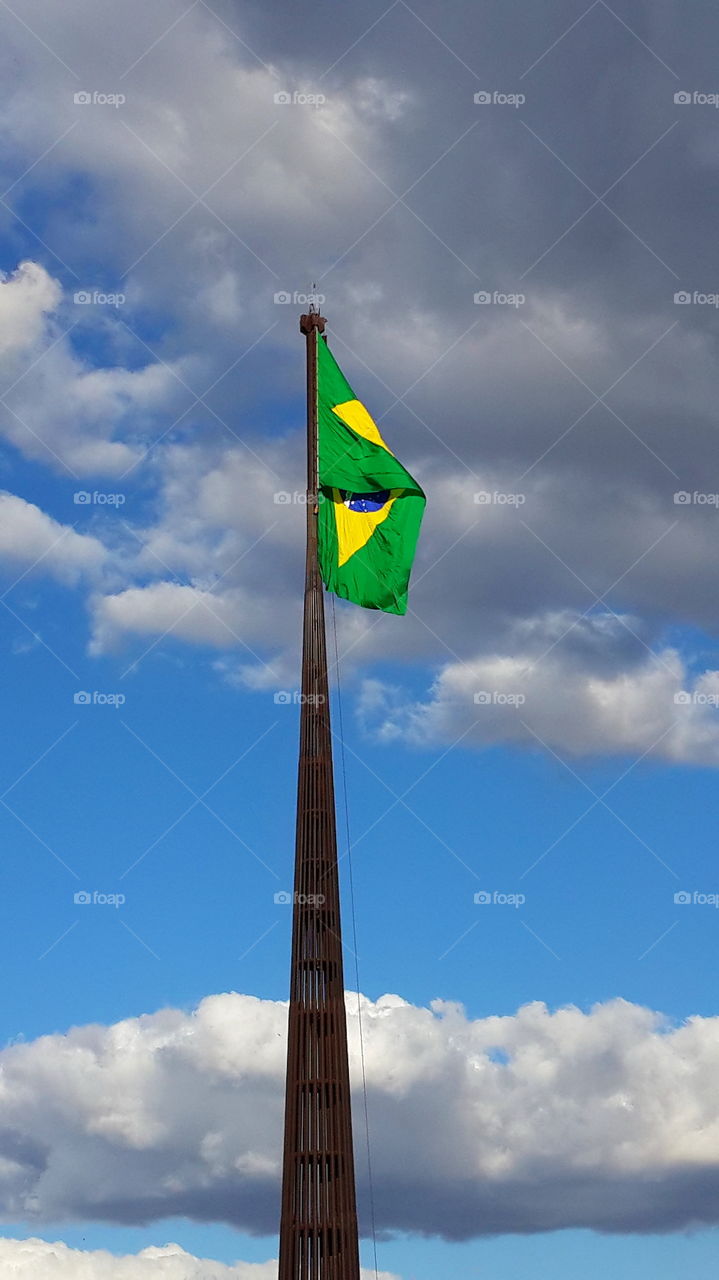 brasilian flag. brasil flag in blue sky