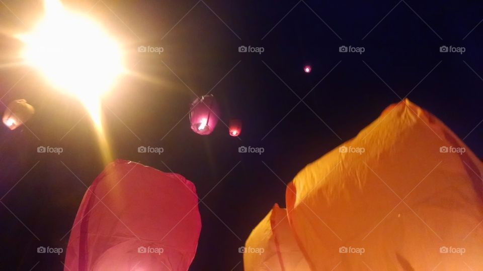 Night skylights. Releasing sky lanterns after wedding reception in Ohio.