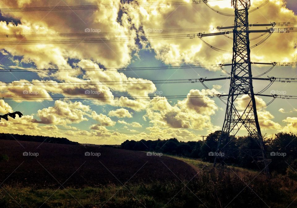 Sunny Autumn sky and freshly ploughed field