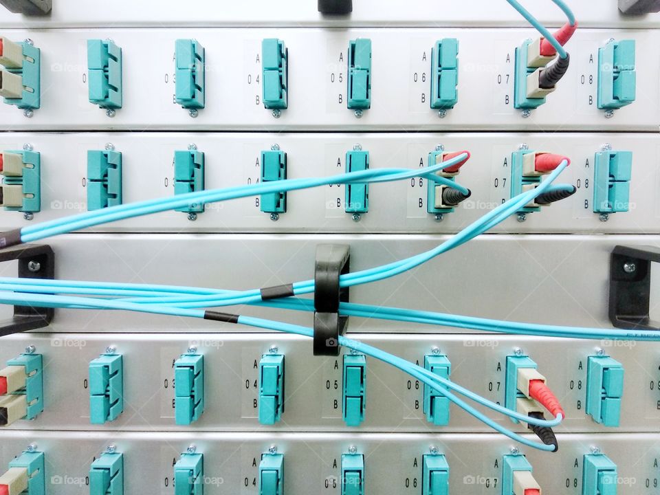 Fiber optic patch-panel in server room, network equipment, IT technology
