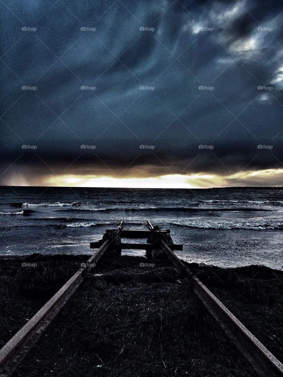 Sun setting before rain