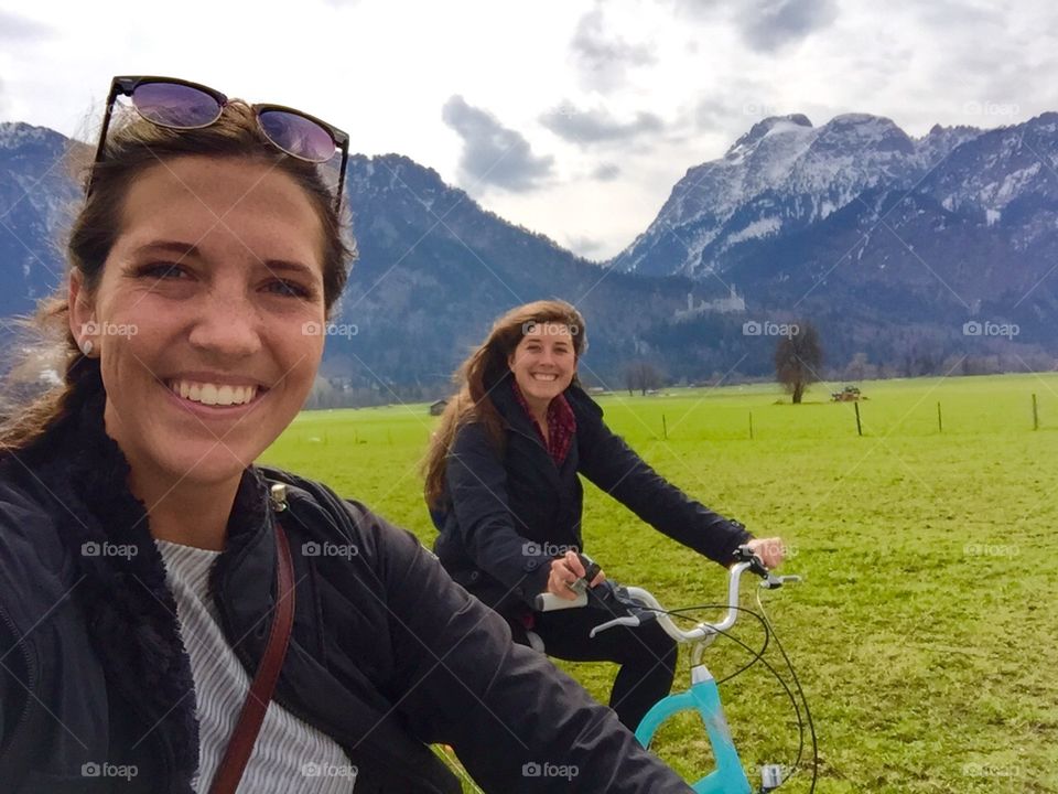 Biking at the base of the Bavarian Alps. A lovely bike ride at the base of the Bavarian Alps with the Neuschwanstein Castle in the background 