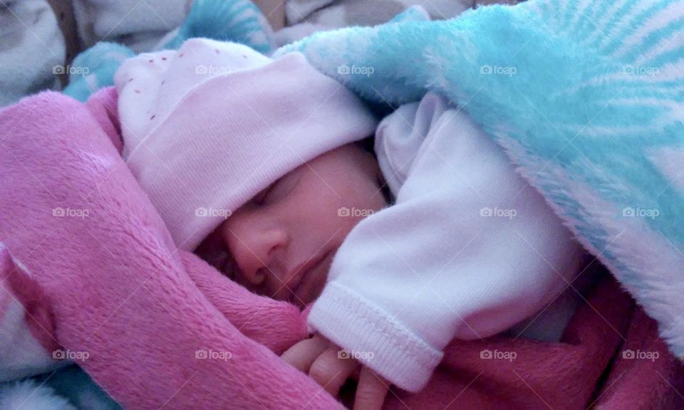 Sleeping newborn baby with beanie 