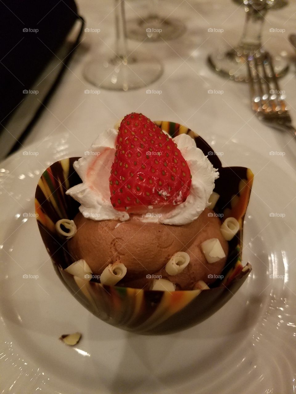 gourmet chocolate dessert, chocolate mousse whipped cream with a strawberry