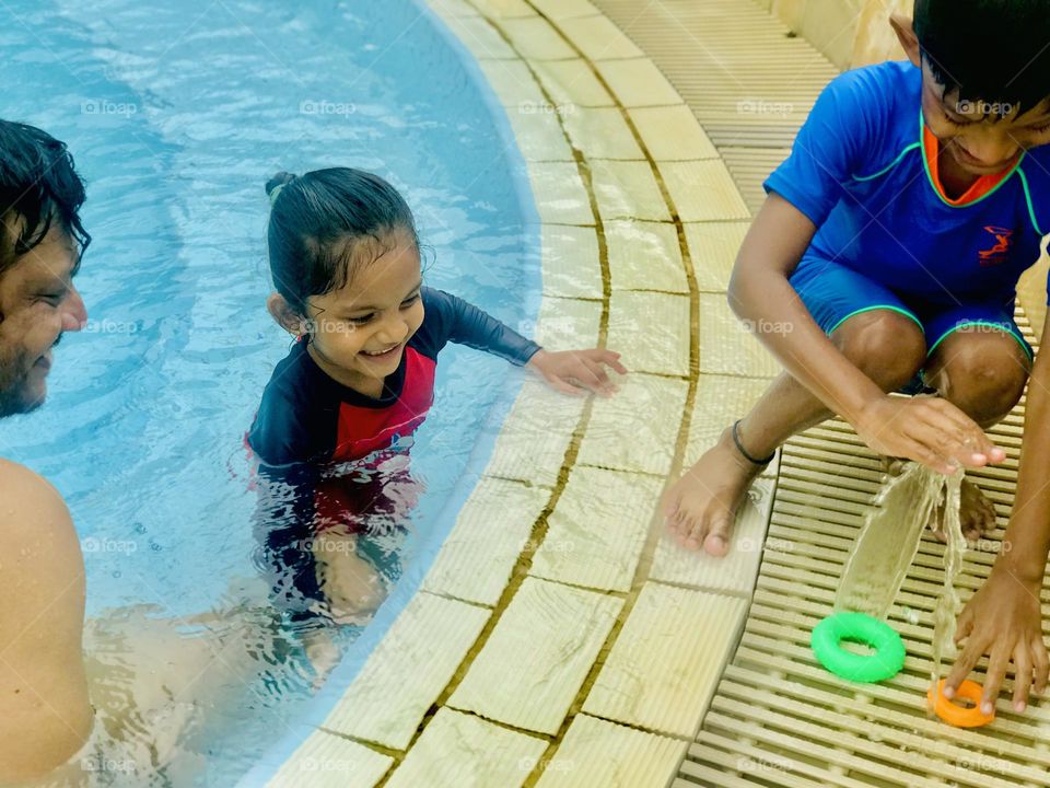Father enjoying at swimming pool with kid’s 😍