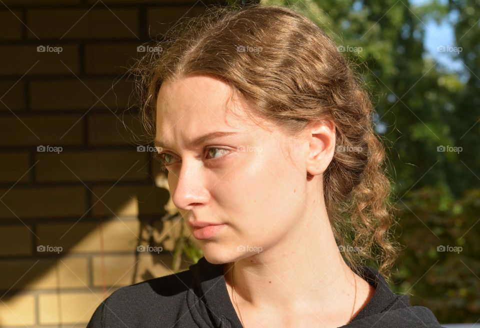 young girl beautiful portrait in sunlight