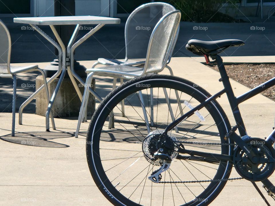 bicycle parked in front of outdoor seating