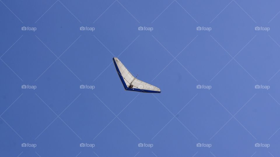 Hang gliding at Brazilian blue sky