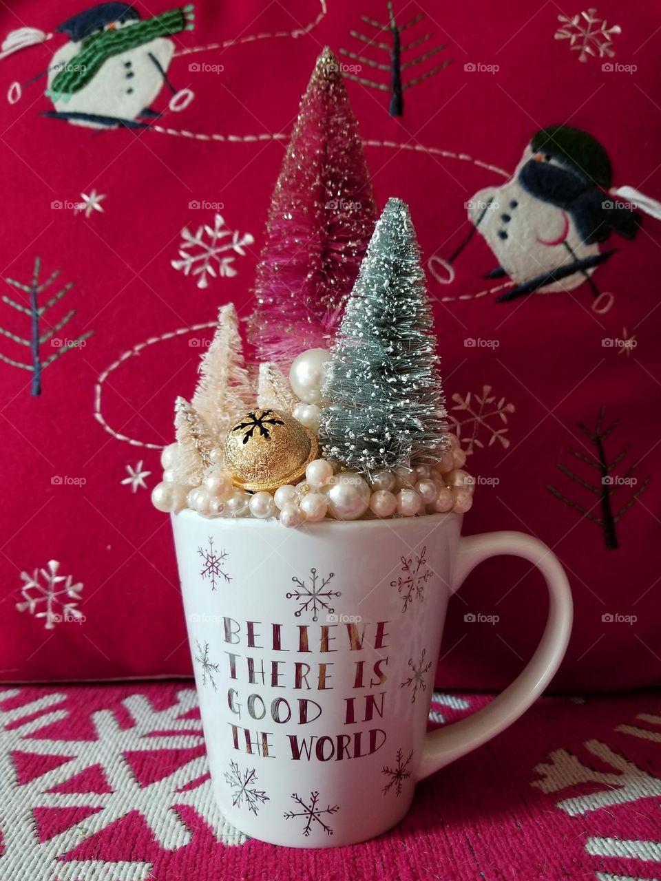 Magenta Christmas Decor with Snowman trees mug with Believe there is good in the world written on it
