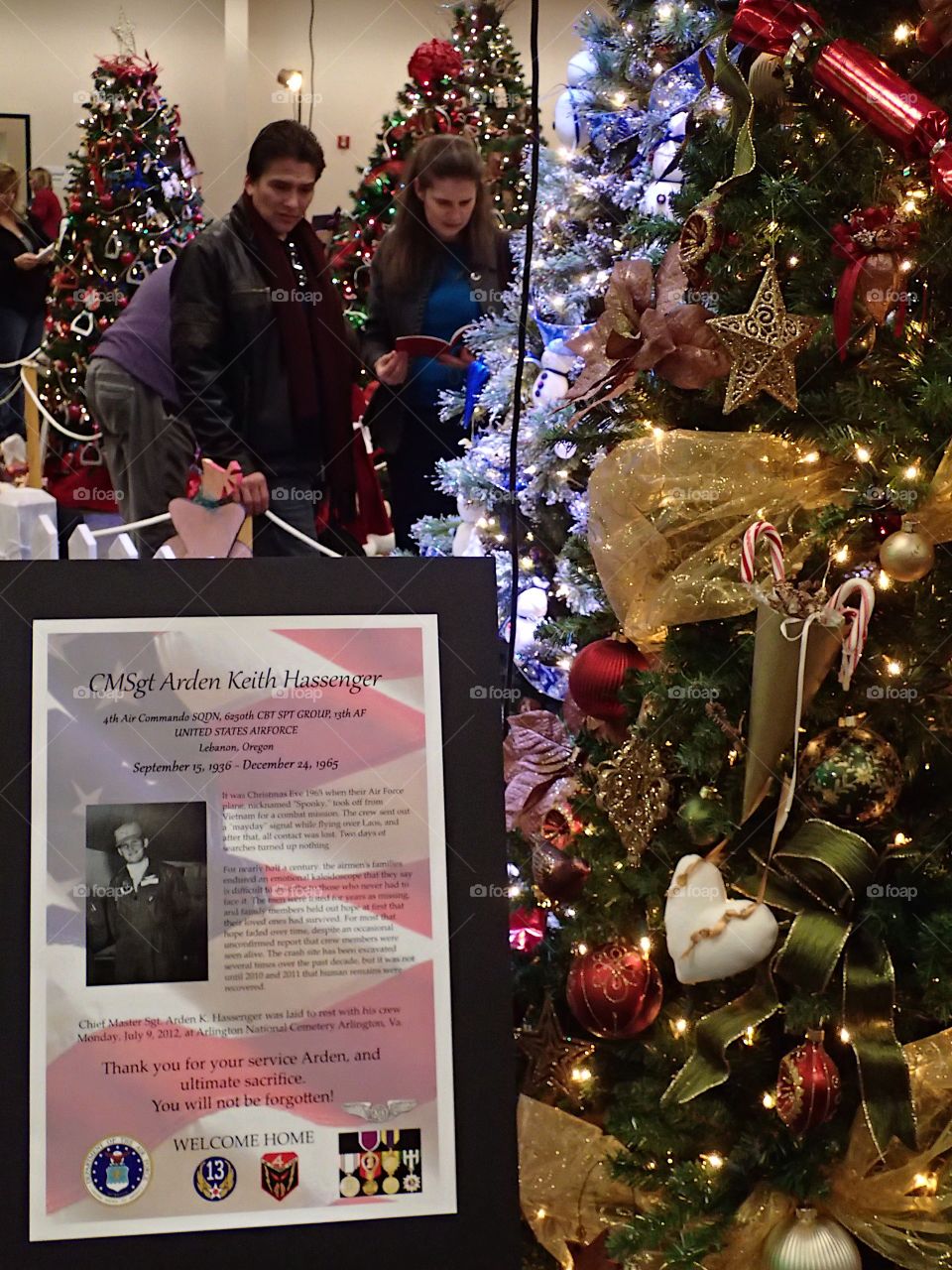 People enjoying some of the beautifully decorated Christmas trees at the annual Central Oregon Festival of Trees fundraising event during the holiday season. 