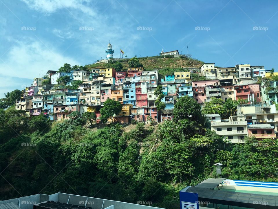 View from luxury hotel in Ecuador overlooking slums — showcasing the duality between wealth and poverty living side by side 